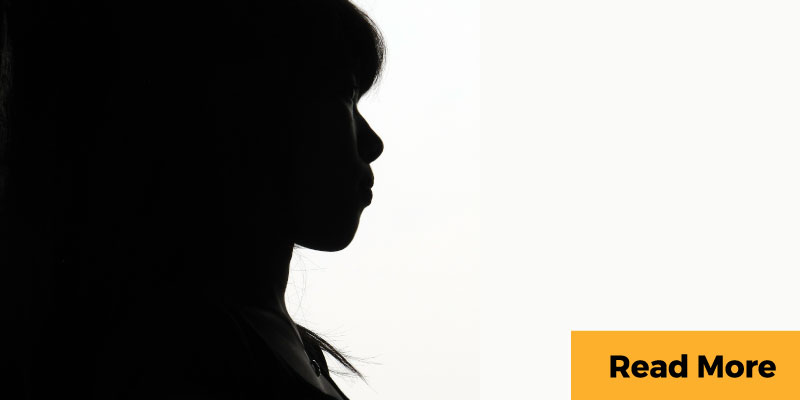 Silhouette of pensive woman
