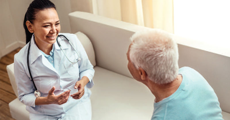 clinician talking to patient