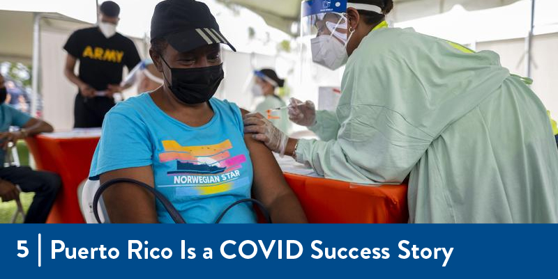 5 - Puerto Rico is a COVID Success Story A person receiving a vaccination