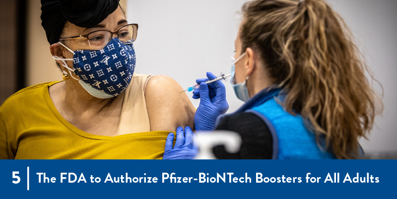 5 - The FDA to authorize pfizer booster for all adults A person receiving a vaccination