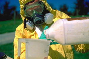 Pesticide handler prepares a solution