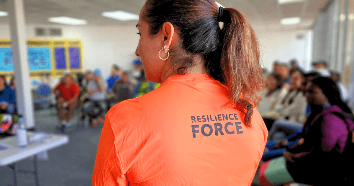 The Resilience Force presenter stands in front of training attendees