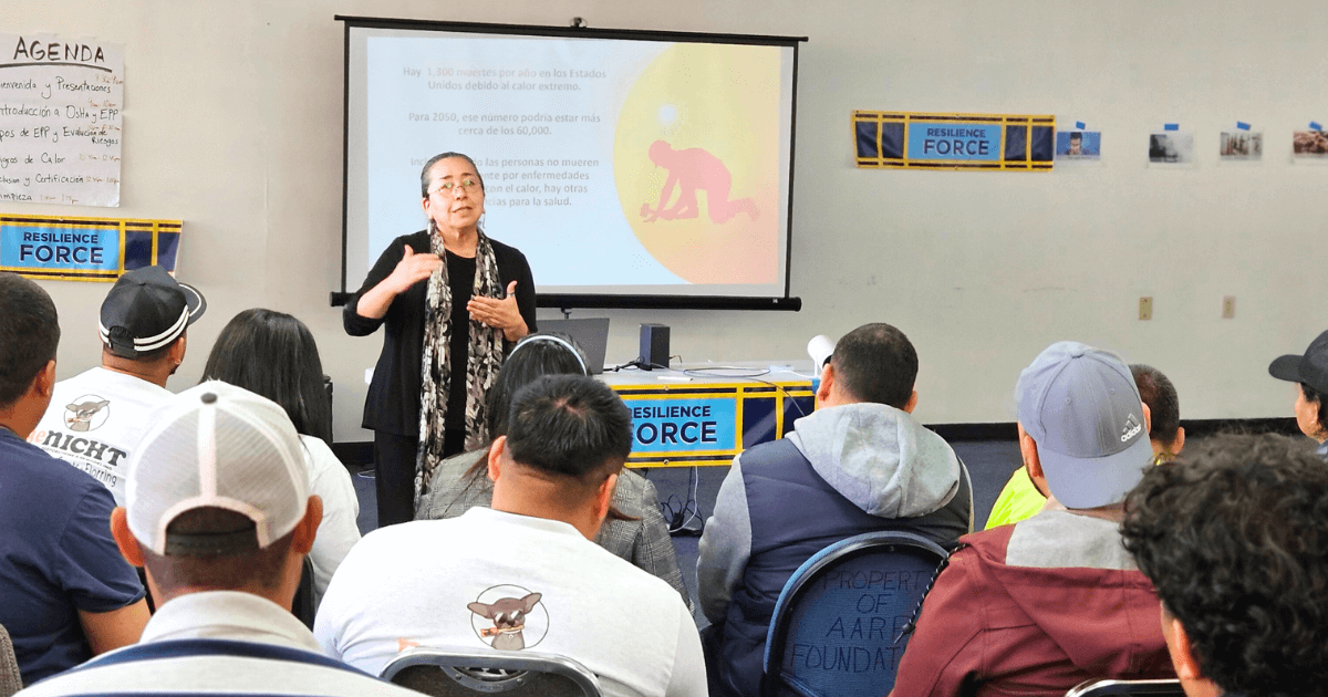 MCN's Alma Galvan presents safety information to climate workers