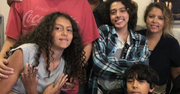 The Rodriguez family. Front row: Liliana, 13, and Alejandro, 10. Back row: Adrian,15; Jose, father; Izaak, 18; and Carmen, mother.