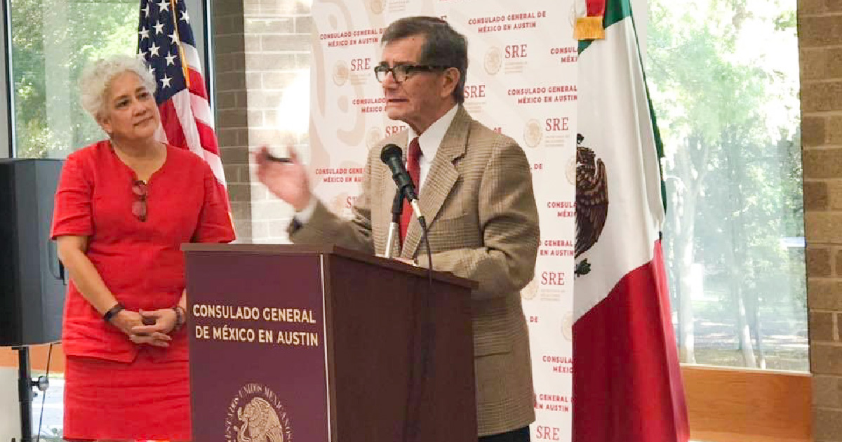 Consul Dr. Pablo Marentes González speaks at the Women's Conference with MCN's Deliana Garcia standing nearby