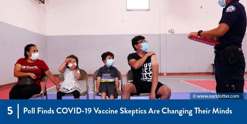 5 - Poll Finds COVID-19 Vaccine Skeptics Are Changing Their Minds People wait in line for vaccination