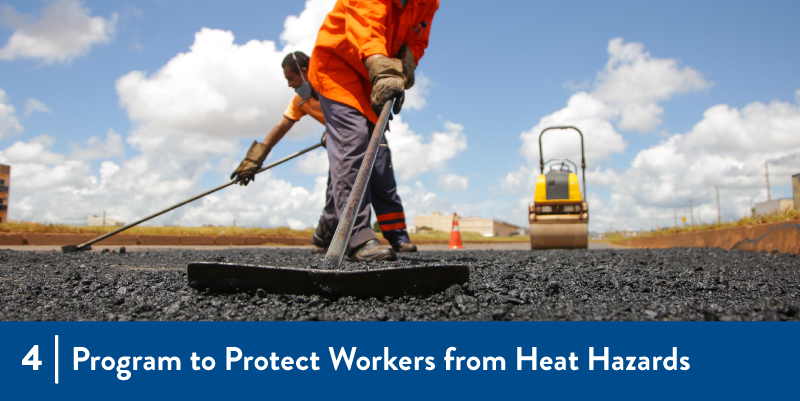 Workers laying pavement