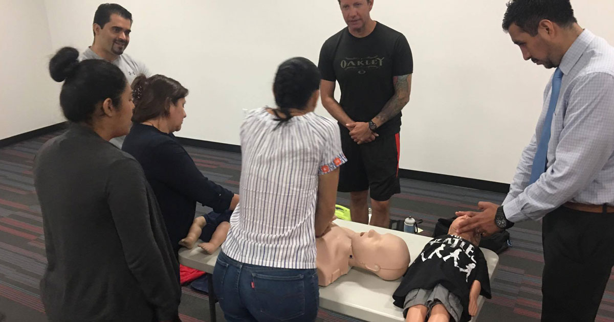 People learning CPR on a dummy