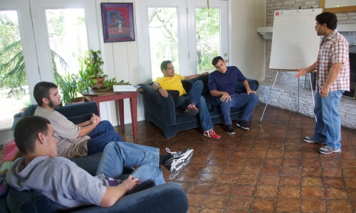 Men gathered in a workshop