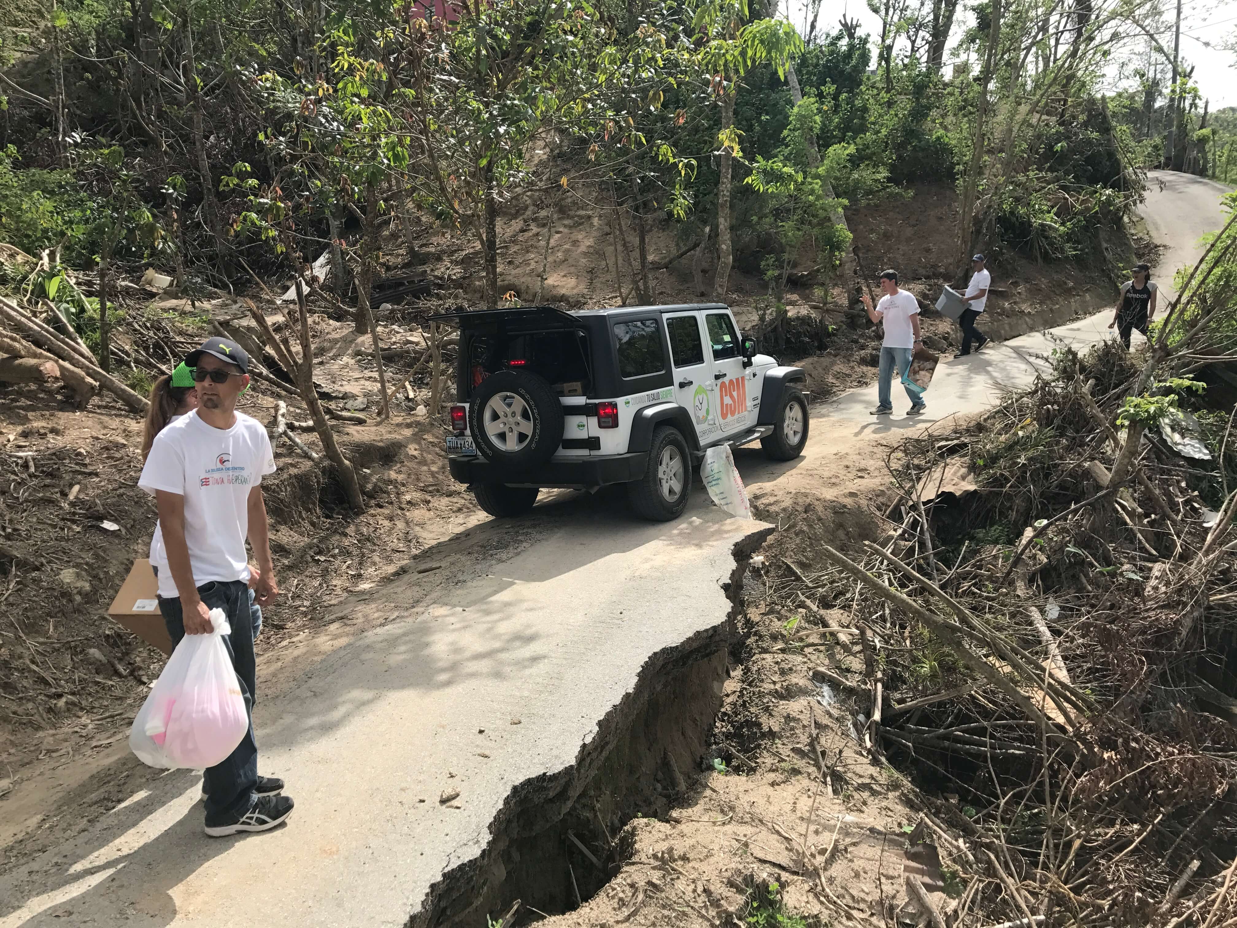 People in the road after a hurricane in Puerto Rico