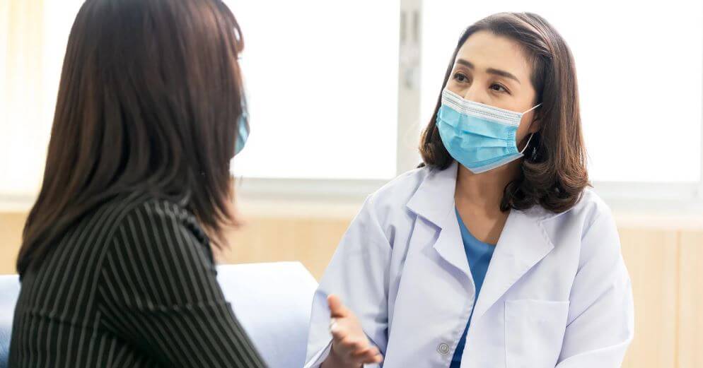 A doctor speaking with a patient