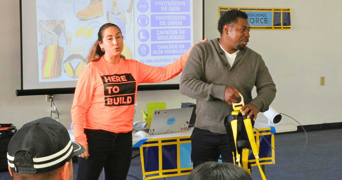 The presenter shows how to properly use a harness
