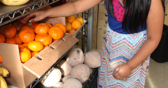 Girl buying fruit