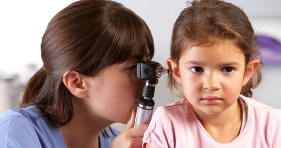 Young girl gets ear inspection
