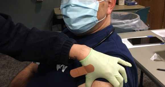 Dr. Laszlo Madaras receives COVID-19 vaccination