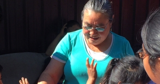 ToÃ±a Sanchez visits with migrant kids