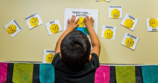 Child choosing faces that match emotions