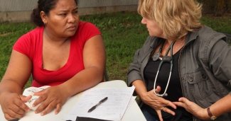 Clinician talking with patient