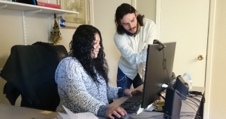 Health Network's Alma Colmenero and Robert Corona discuss a case in the MCN office in Austin, TX.
