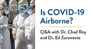 Clinicians gather outside wearing PPE