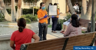 Community health Worker speaking to participants