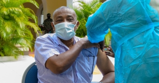 Man is given COVID-19 vaccine