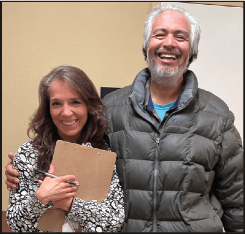 Maria Jose Hummel, PhD, MPH (left) speaking with a participant who has joined the program for many months.